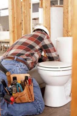 Allen TX plumbing professional installs toilet